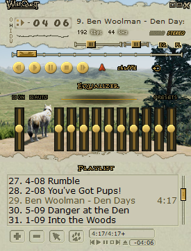 a wolfquest-themed winamp skin that uses lots of paper textures and is predominantly tan, gold, and warm brown. in the center is a screenshot of a wolf sitting on a cliff, overlooking the lamar valley,