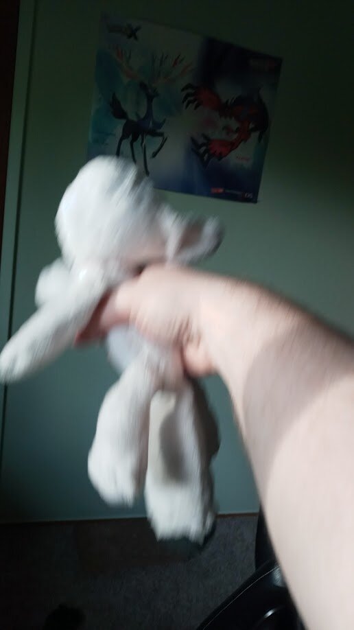 the dogthing plushie being shaken violently