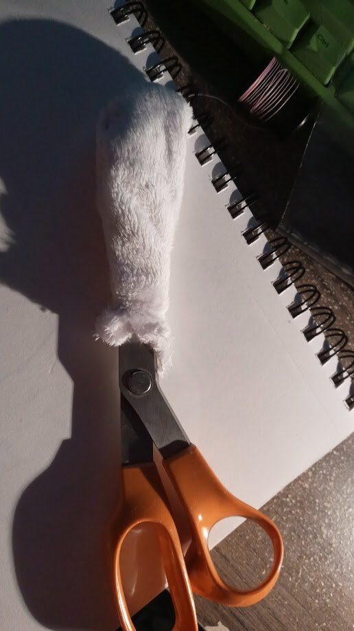 the leg flipped inside out with a pair of scissors inside of it, implying that it was used to turn it out.
