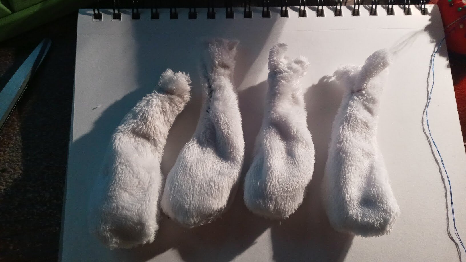 four flipped-out legs in a row, resembling tempura shrimp if it were fluffy and white.