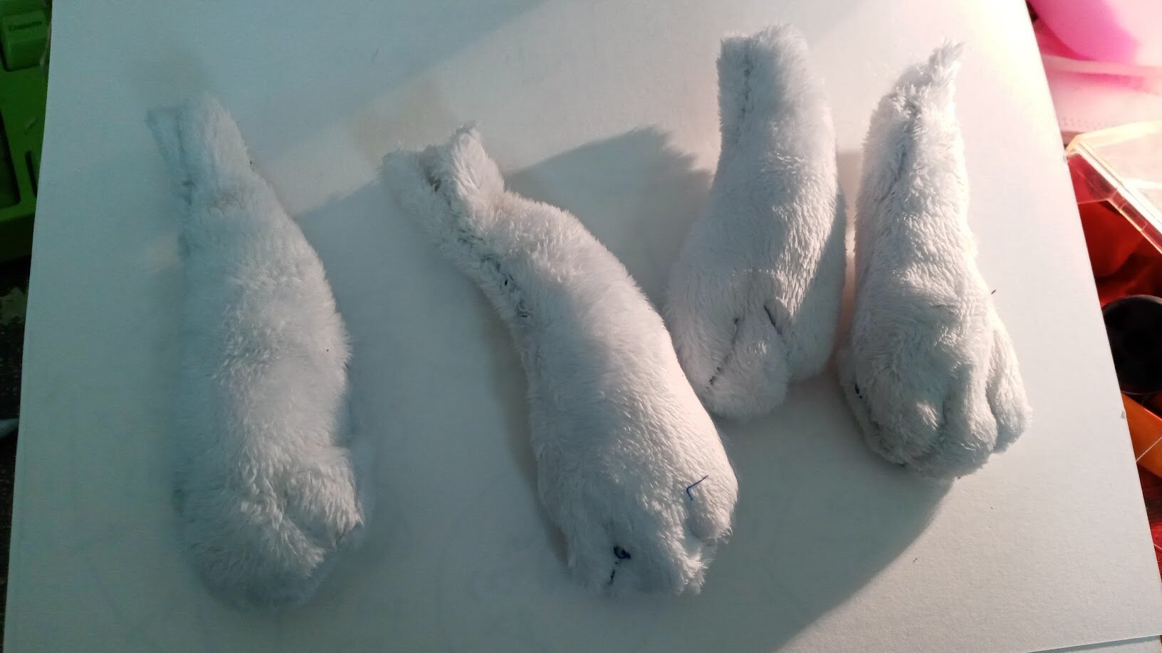 the four legs assembled on a white background weezer-style, with little toe lines added as well as stuffing filled in.