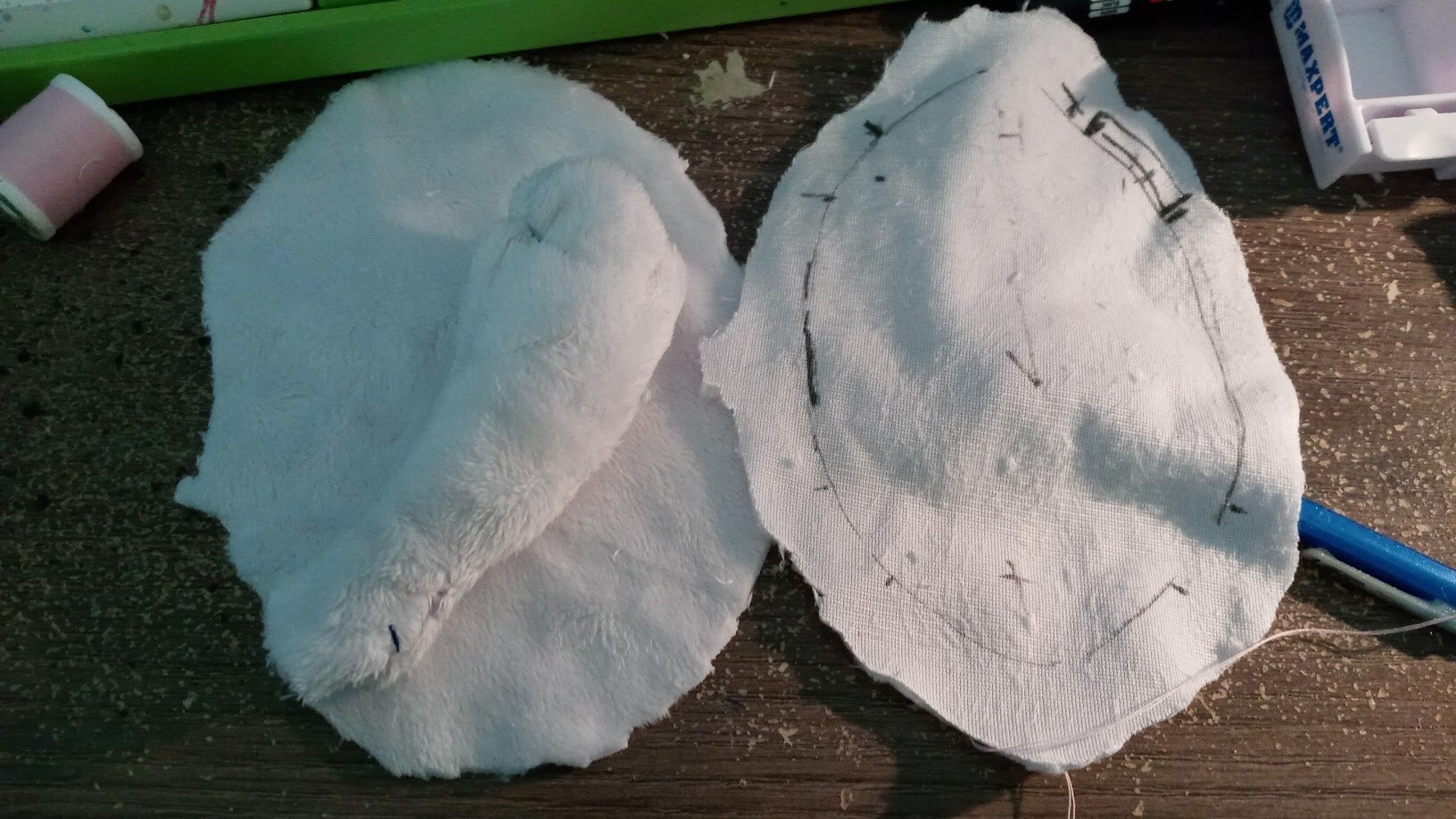 one leg folded inwards on one half of the body, with the other half flipped to show the seam lines